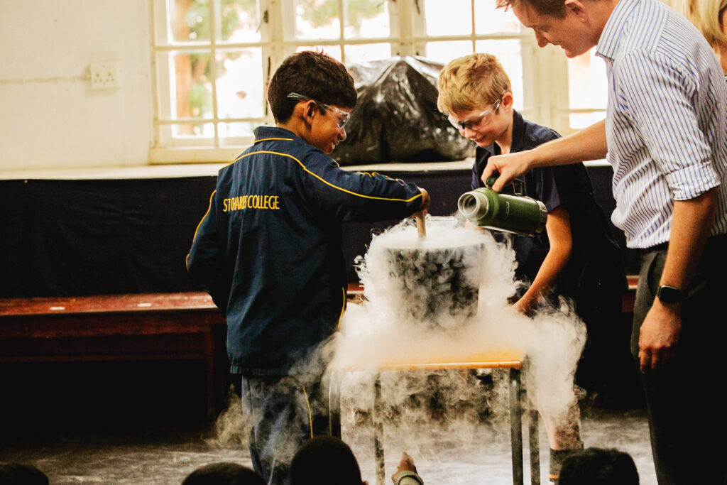 Junior Primary boys doing an experiment during an interactive lesson